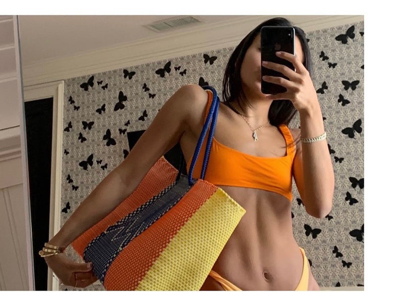 Colorful woven basket tote bag for the pool and beach. 