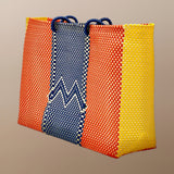 Blue, white, tangerine organ, yellow woven basket tote bag.